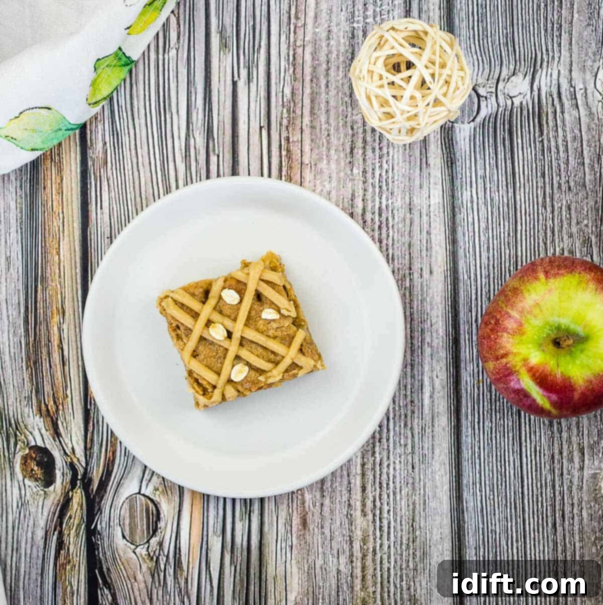 A beautifully baked Brown Butter Apple Blondie, garnished and ready to be served and savored.
