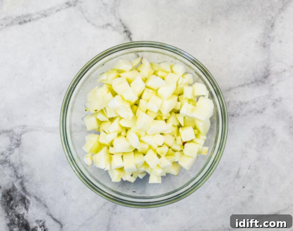 A bowl of freshly diced apples, ready to be folded into the blondie batter.