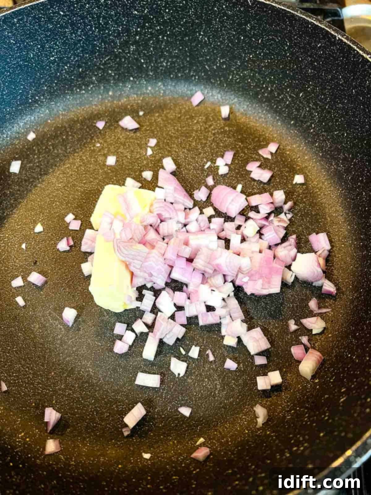 Sauting the shallots in butter.