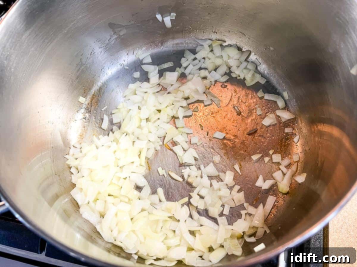 Sauteing the onion in a large pot.