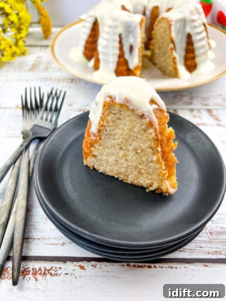 Banana Buttermilk Cake slice and the whole cake in the background.