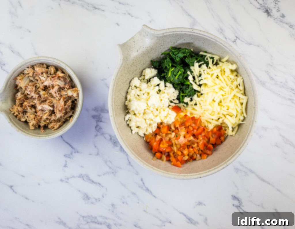 Mix all ingredients except the crab in a bowl.