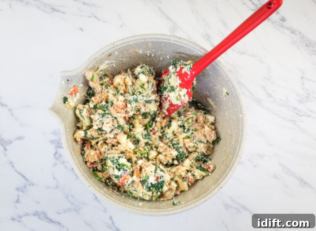Crab meat gently folded into spinach mixture.