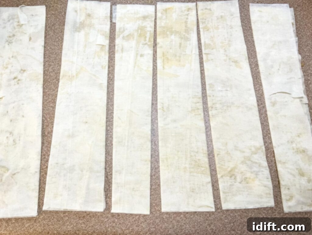 Buttered phyllo layers cut into 2-inch strips.