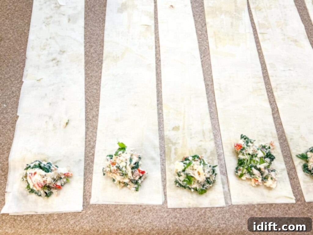 Crab filling at the bottom of each phyllo strip.