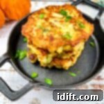The Heart of Thanksgiving Dinner 12 Stuffing, Turkey, and Mashed Potato Patties in a stack in a black serving dish.