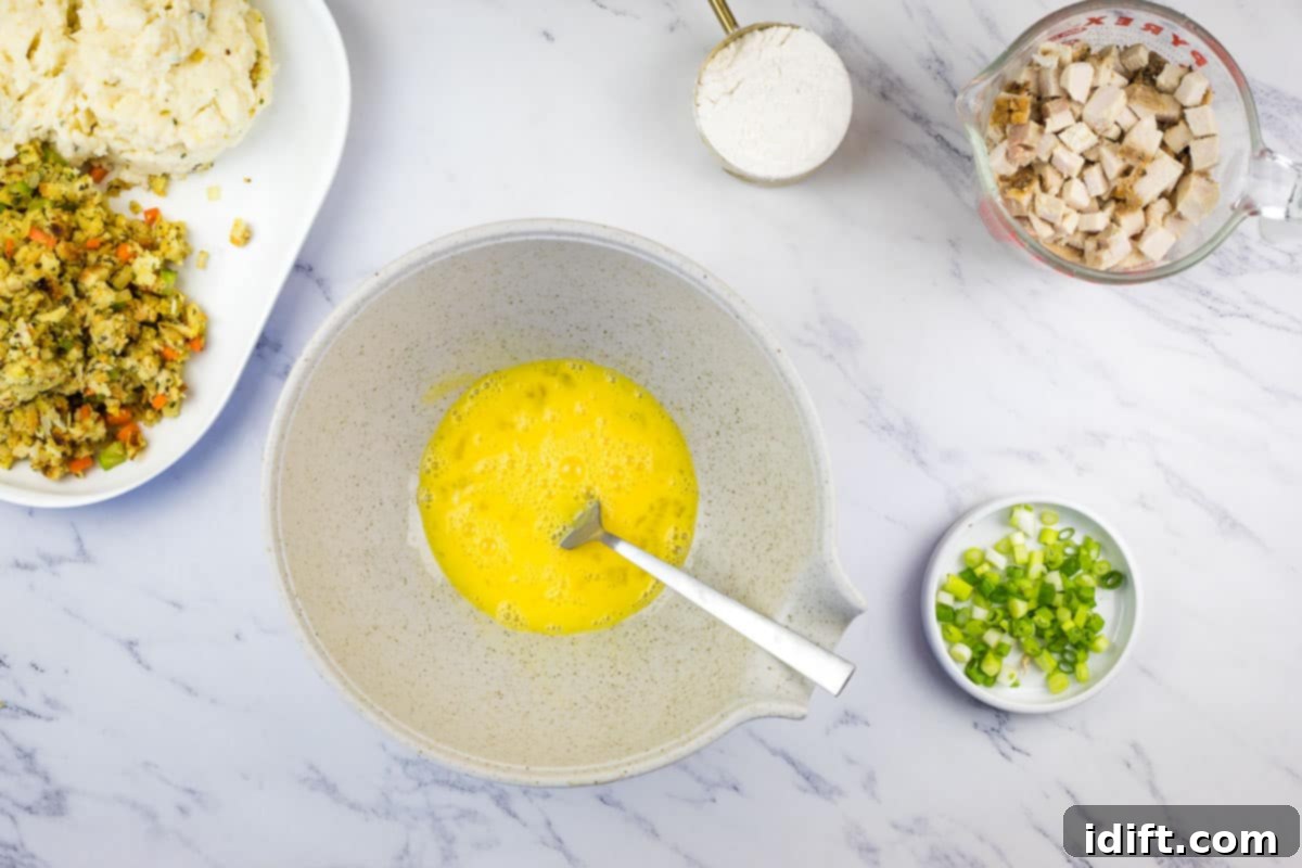 The Heart of Thanksgiving Dinner 6 Whipped eggs in a medium sized bowl.