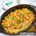 Fiery Crumb Carrot Bake 15 Carrots au gratin in a black oval serving dish.