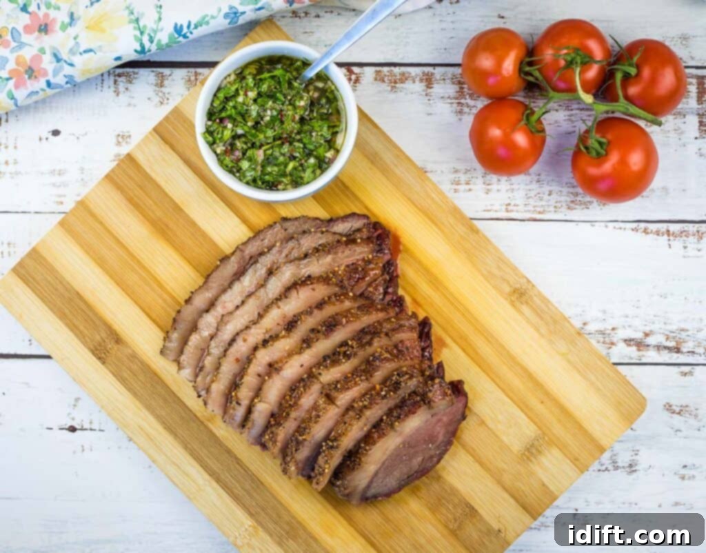 Perfectly Smoked Picanha 3 A top-down shot of beautifully sliced Smoked Picanha on a cutting board, displaying a perfect medium-rare doneness.