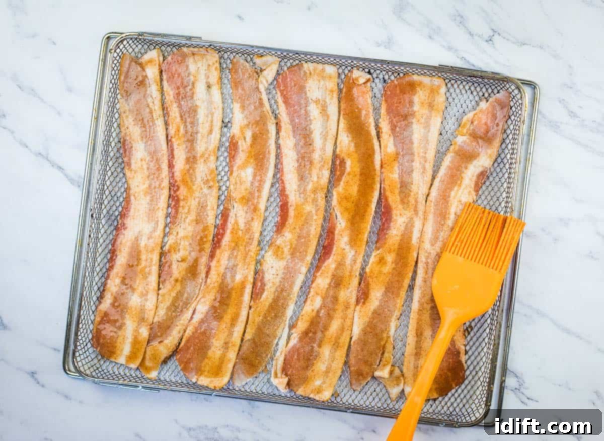 Millionaire's Bacon 8 Brushing the bacon with the sugary glaze.