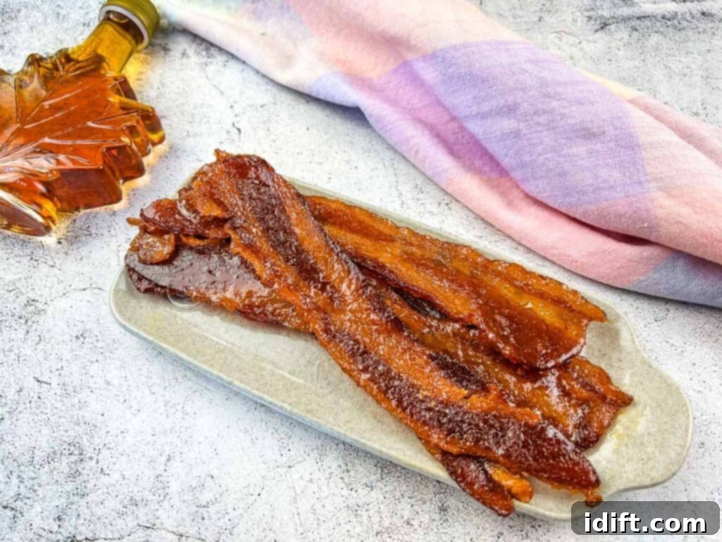 Millionaire's Bacon 3 Smoked candied bacon on a white plate.