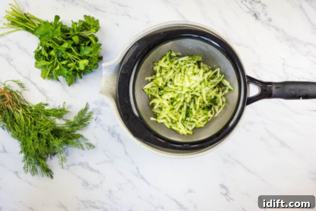 Draining the grated salmon.