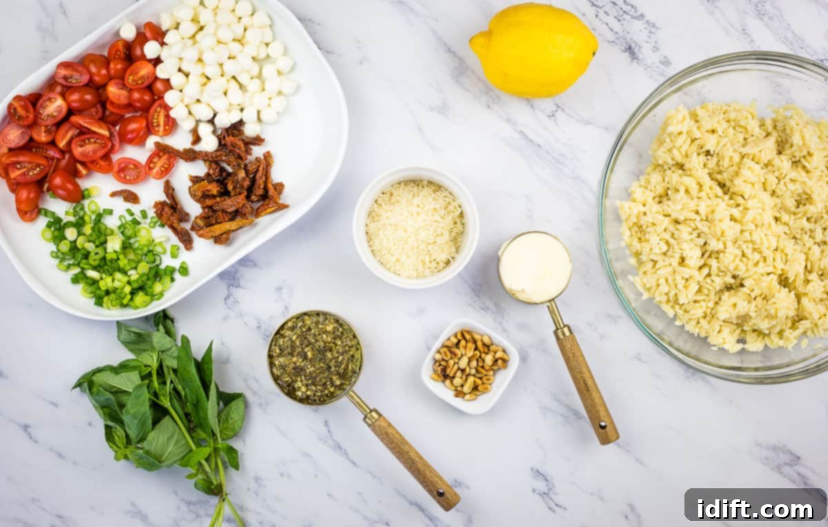 All the fresh ingredients for pesto orzo salad, neatly prepped and ready for mixing.