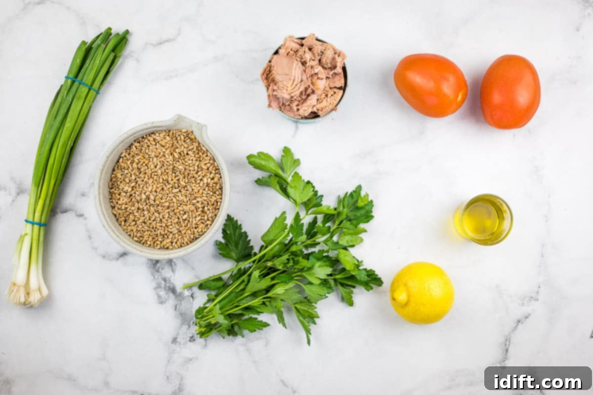 Ingredients arranged to make Wheat Berry Salad with Tuna and Tomatoes, ready for preparation.