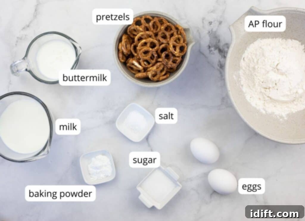 Clearly labeled ingredients, including flour, pretzels, sugar, baking powder, salt, milk, buttermilk, and eggs, laid out on a kitchen counter, ready to make pretzel pancakes.