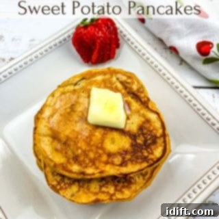 A stack of golden sweet potato pancakes, crowned with a pat of melting butter, promising a delightful and comforting breakfast.