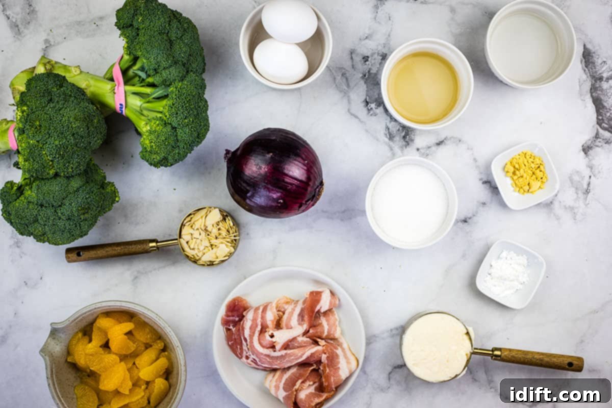 Vibrant Broccoli Salad with Zesty Orange and Smoky Bacon Crunch 5 Ingredients for Classic Broccoli Salad with Bacon and Almonds laid out on a clean surface.