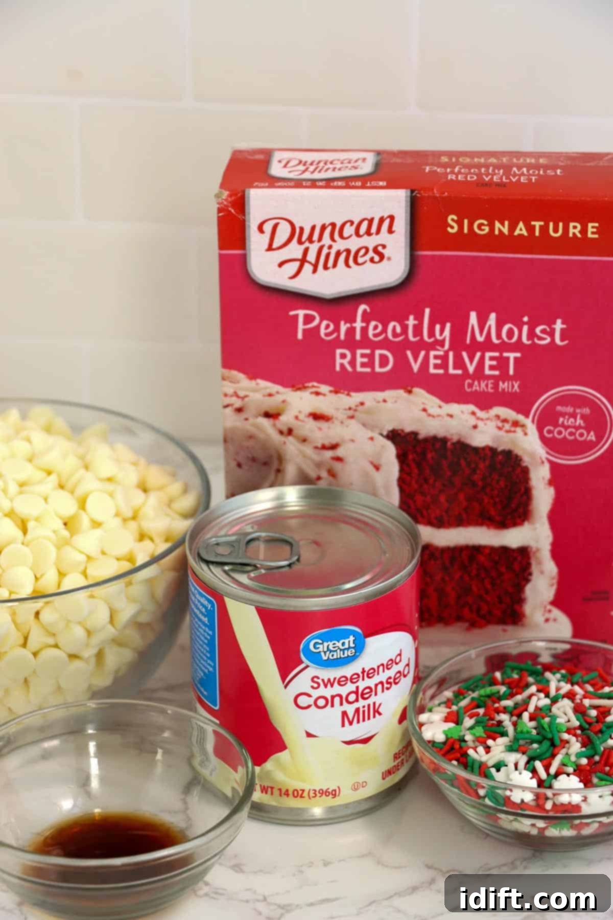 All the necessary ingredients laid out to make red velvet Christmas truffles.