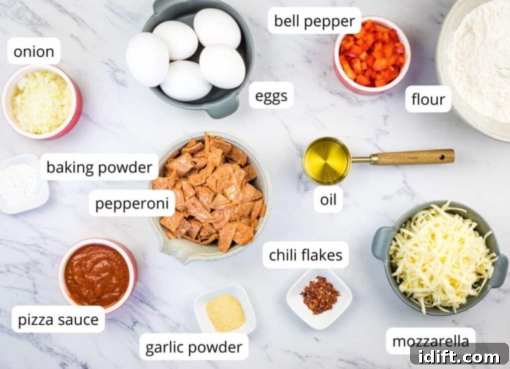 Savory Pizza Cups 4 A visually organized display of all the labeled ingredients required to make delicious Pizza Muffins, set against a rustic background.