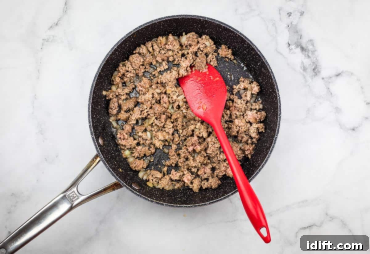 Shepherds Pie Poppers 7 Browned ground beef in a skillet.