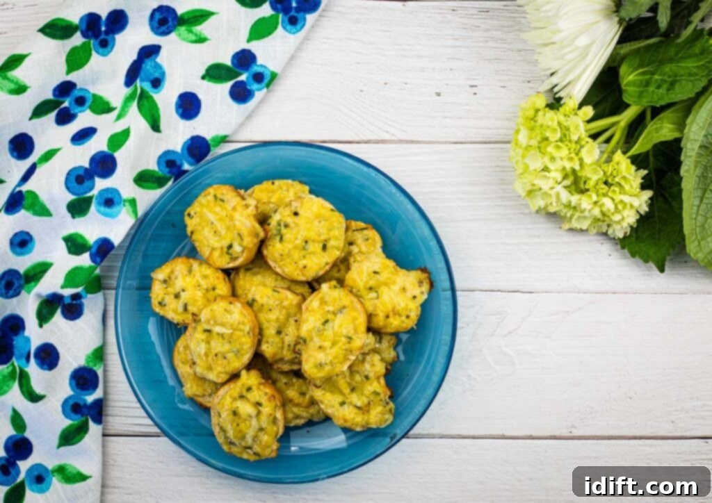 A top-down view of freshly baked, golden-brown cheese toasties on a vibrant blue plate, garnished slightly.