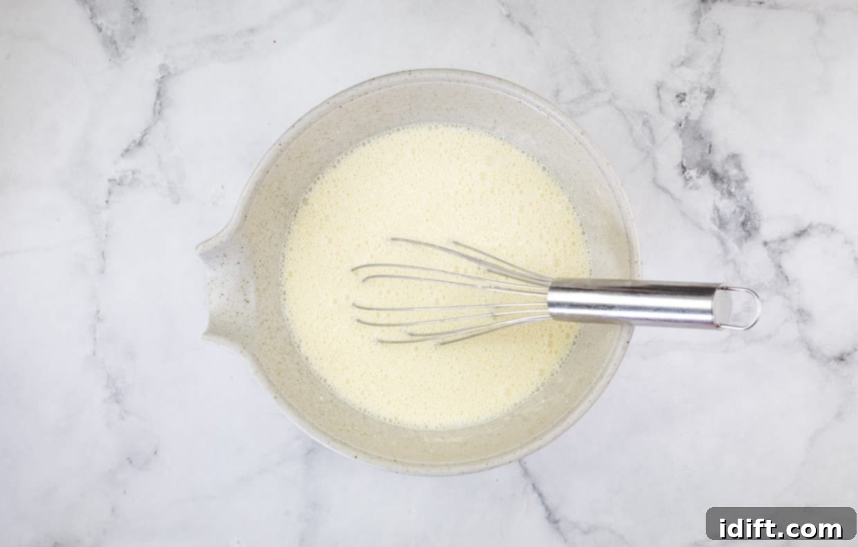 The mixed custard to make Ham & Cheese Impossible Quiche.