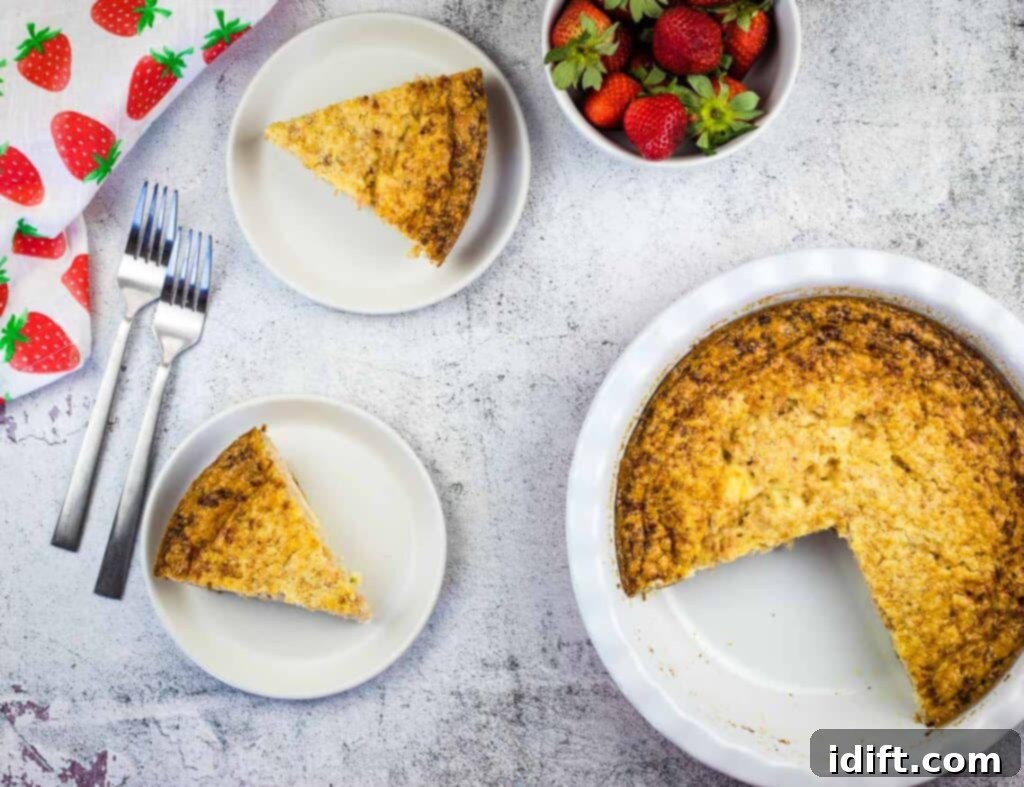 Ham & Cheese Impossible Quiche on plates with whole quiche nearby.