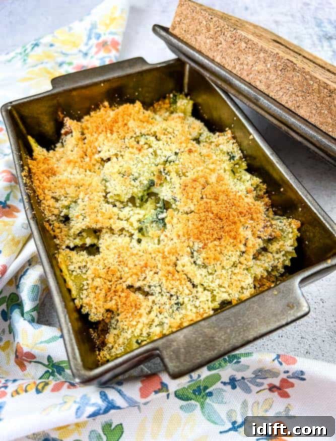 Chicken Florentine Artichoke Casserole 2 Chicken Florentine Artichoke Bake in a casserole dish with lid nearby.