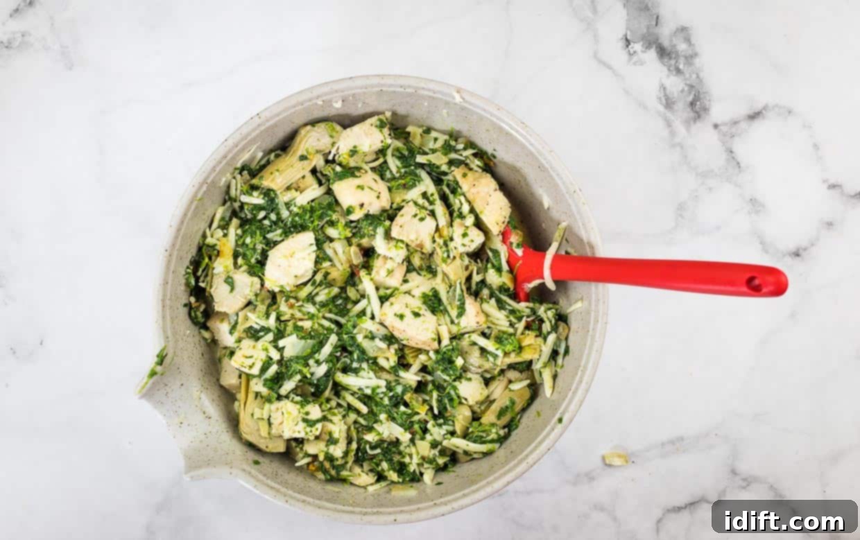 Chicken Florentine Artichoke Casserole 8 Ingredients mixed together.