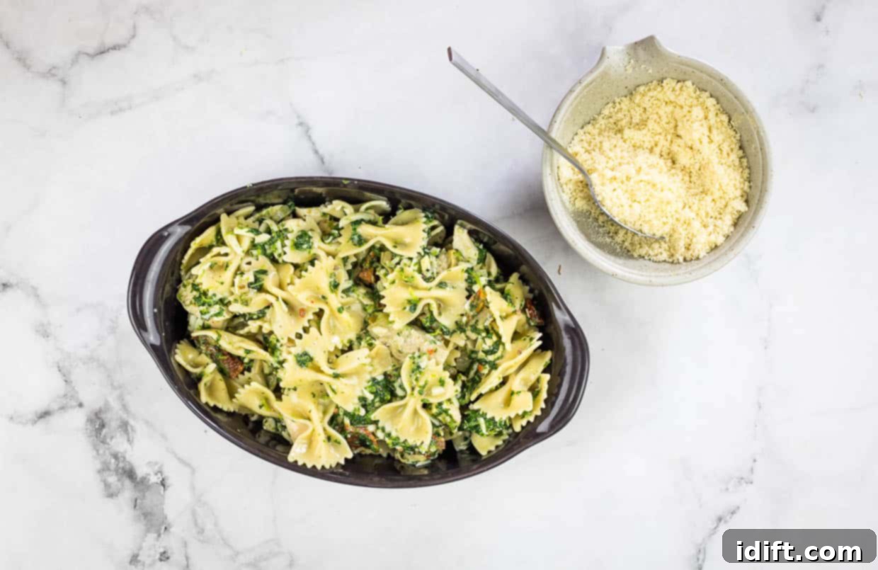 Chicken Florentine Artichoke Casserole 10 Ingredients in a casserole dish ready for the topping.