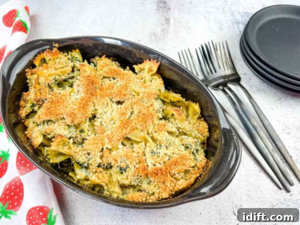 Chicken Florentine Artichoke Casserole 3 A top-down shot of Chicken Florentine Artichoke Bake in a casserole dish.