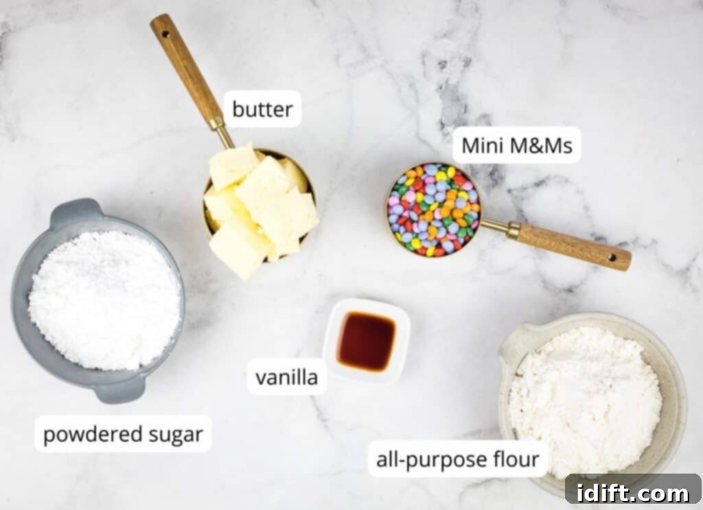 Spring Blossom Shortbread with Cheerful Candy Drops 4 Labeled ingredients to make Easter Shortbread Cookies: Butter, Flour, Icing Sugar, and Mini M&Ms.