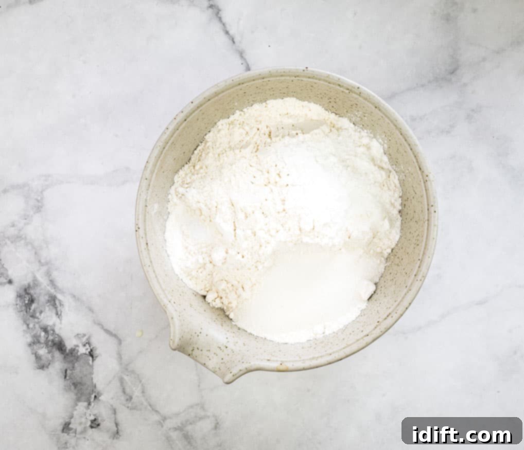 Sausage Pancake Poppers 8 Mixing the dry ingredients together in a large bowl with a whisk.