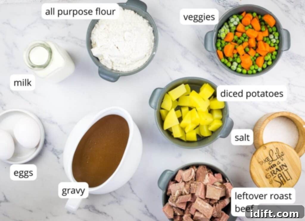 Various labeled ingredients laid out on a kitchen counter, ready to be combined for making Leftover Roast Beef Yorkshire Pudding Pie.