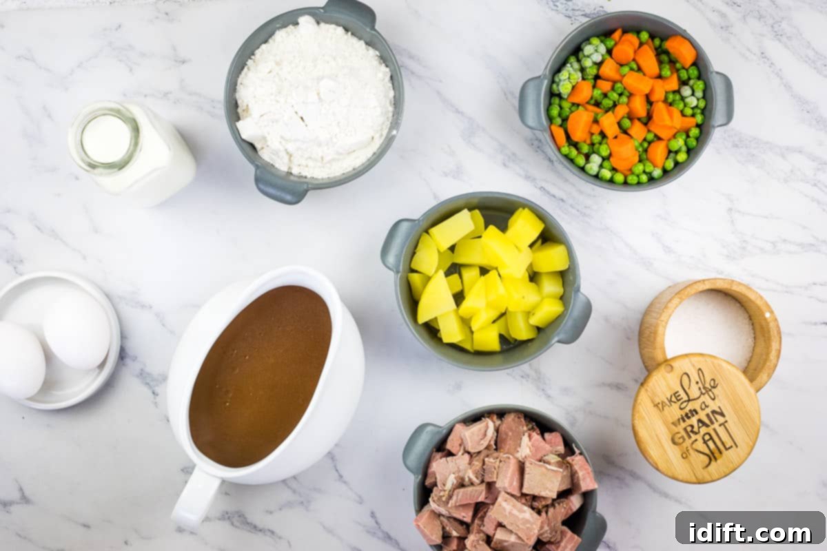 Ingredients for Leftover Roast Beef Yorkshire Pudding Pie laid out, showcasing fresh milk, eggs, flour, and prepared beef and vegetables.