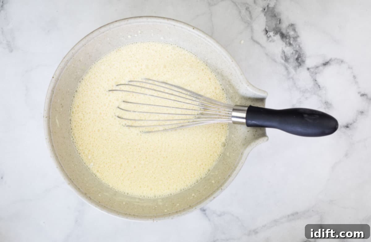 Impossible Broccoli Three-Cheese Quiche 10 The smooth, liquid custard mixture, after Bisquick, milk, and heavy cream have been whisked into the eggs.