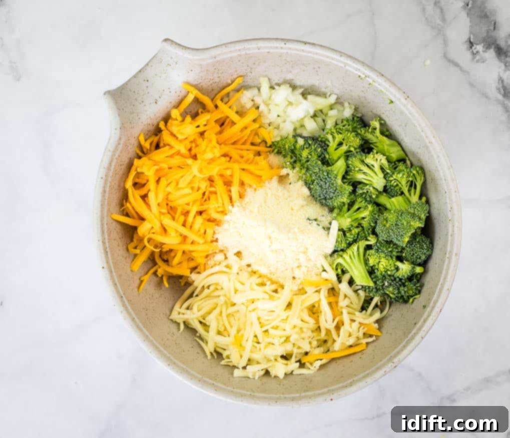 Impossible Broccoli Three-Cheese Quiche 7 Freshly chopped broccoli florets in a bowl, ready to be mixed with other dry ingredients for the quiche.