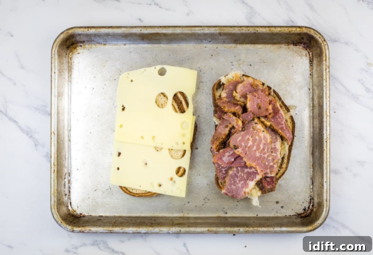 Open faced sandwich on a baking sheet.