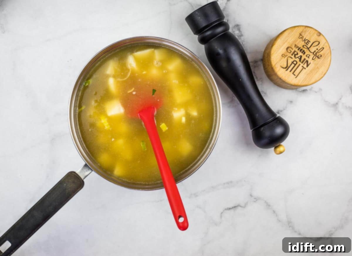 Potato and Green Pea Chowder 8 Vegetable broth and diced potatoes added to the sautéed leek mixture in the pot.