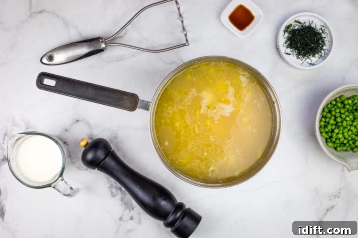 Potato and Green Pea Chowder 9 Soup with some partially mashed potatoes, showing a slightly thickened texture.