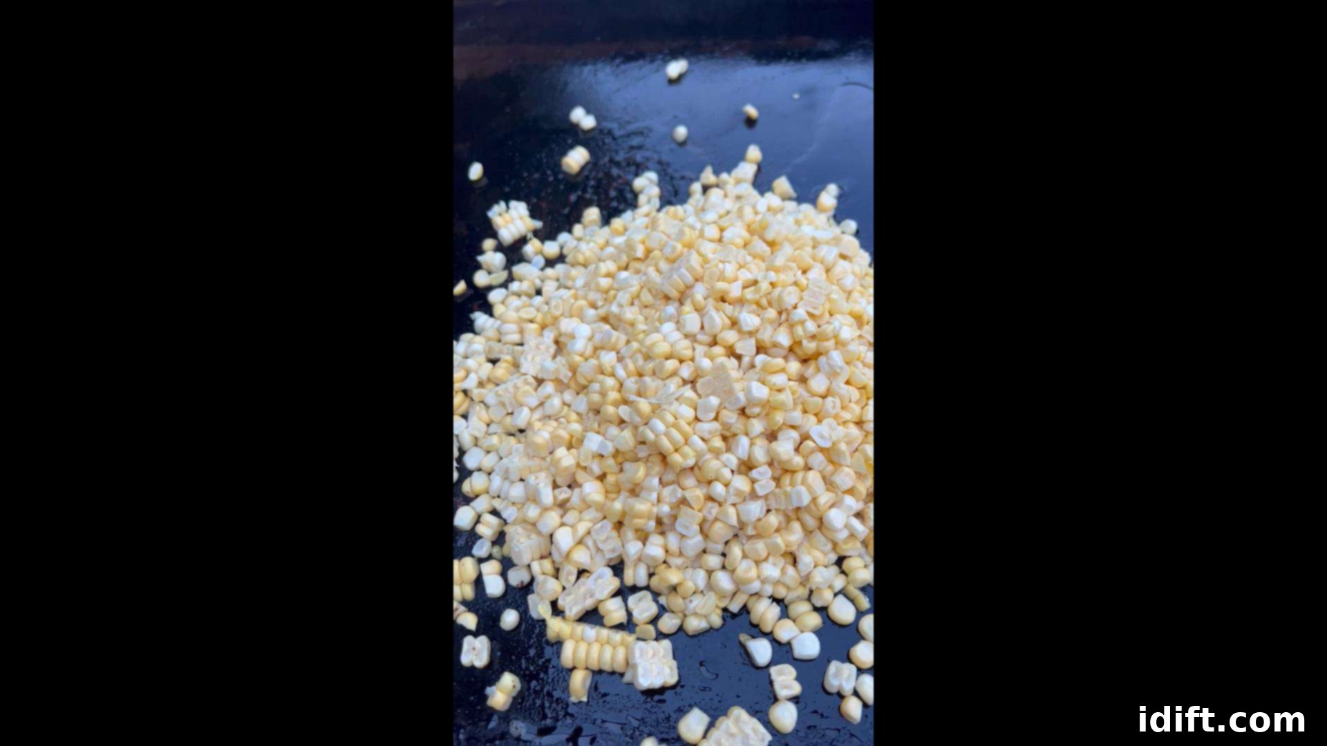 Blackstone's Sizzling Bacon Corn 8 Corn cooking on a hot griddle in bacon fat.