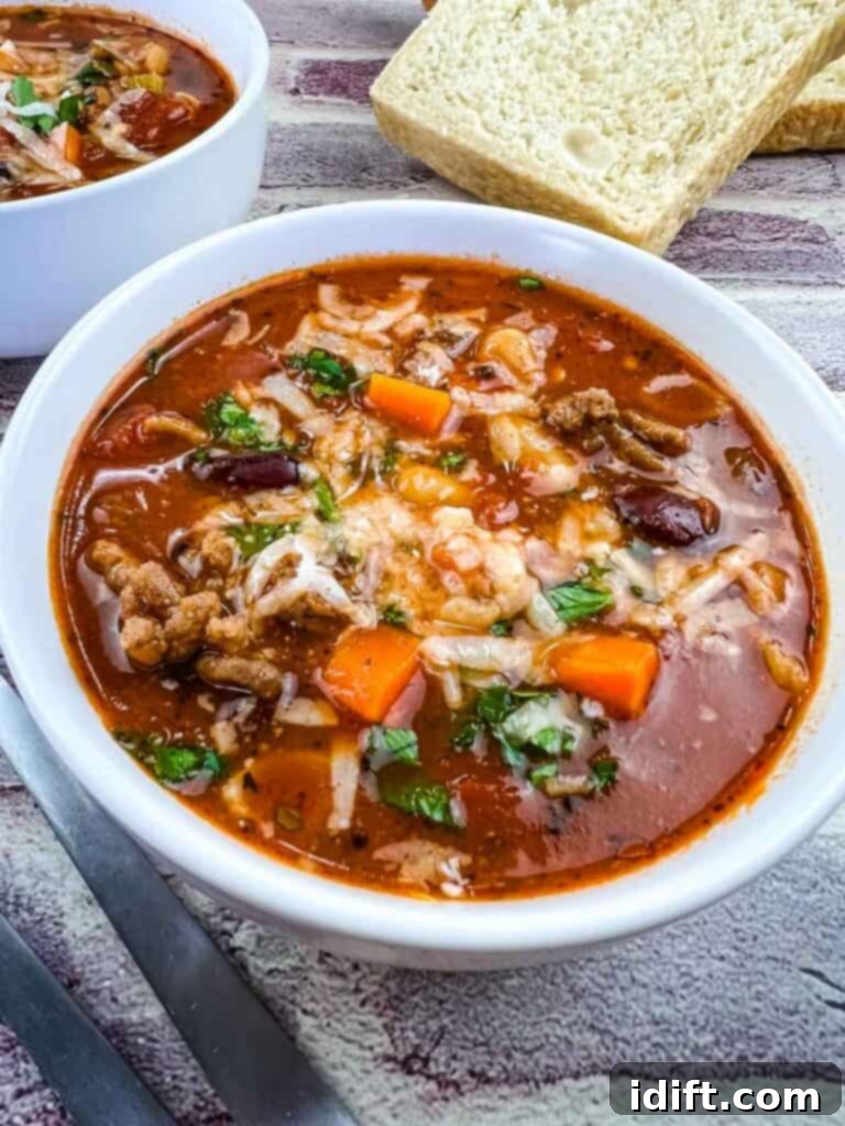 A closeup of a bowl of finished Pasta e Fagioli Soup, ready to be served and enjoyed.