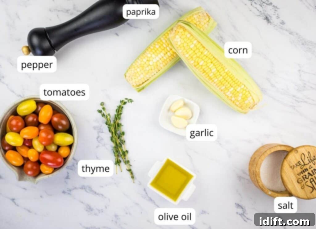 A selection of labeled fresh ingredients laid out on a board, including grape tomatoes, corn, herbs, and feta, ready to make the Tomato Bruschetta Board.