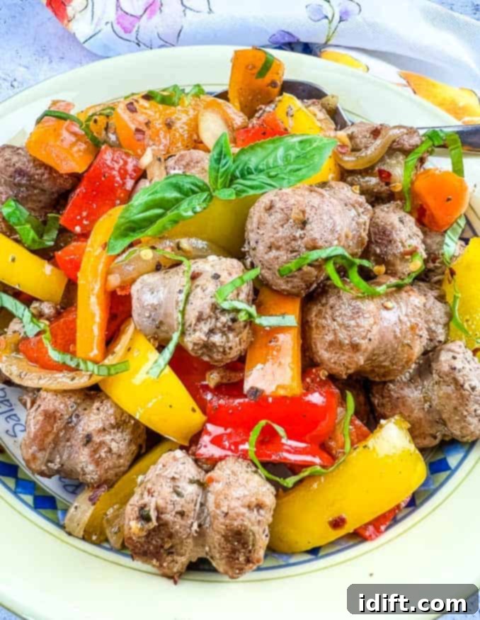 Blackstone Sausage & Peppers in a serving bowl, showcasing vibrant colors.