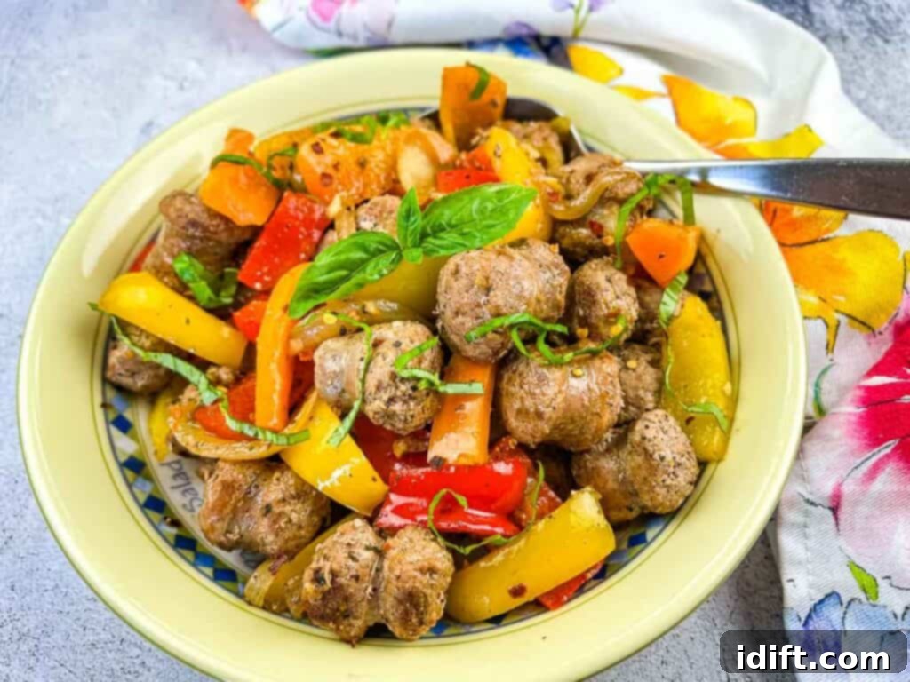 Finished Blackstone Sausage & Peppers in a serving bowl, ready to eat.