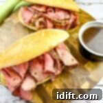 Smoked French Dip Sandwiches with jus on the side.