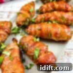 Summer Cookout Feast 8 Pork Stuffed Smoked Jalapeno Poppers on a plate.