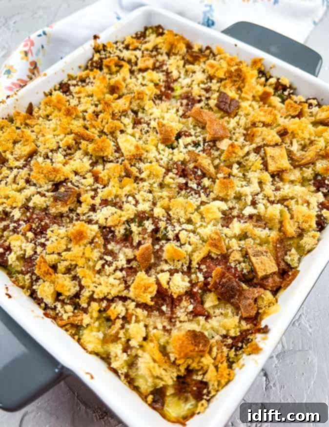 A closeup shot of Corned Beef Hash Casserole, showcasing its golden-brown crust and rich interior.