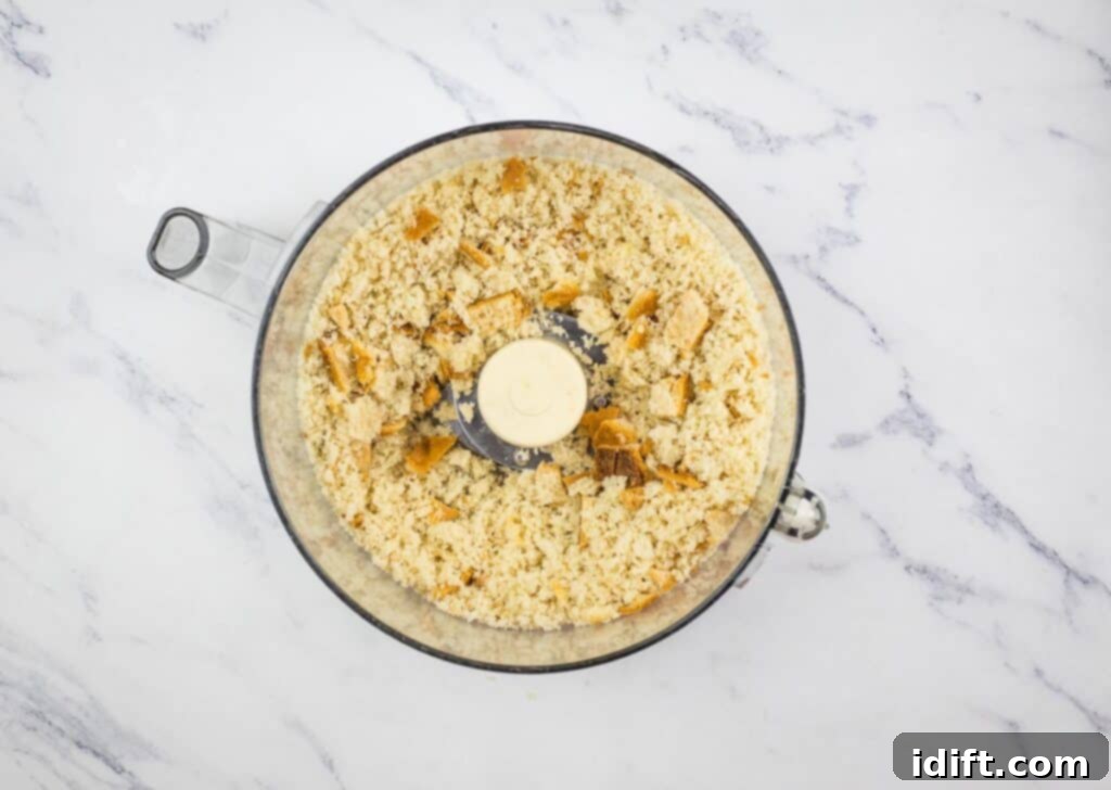 Hearty Corned Beef Hash Bake 7 Rye bread slices being processed into crumbs in a food processor.
