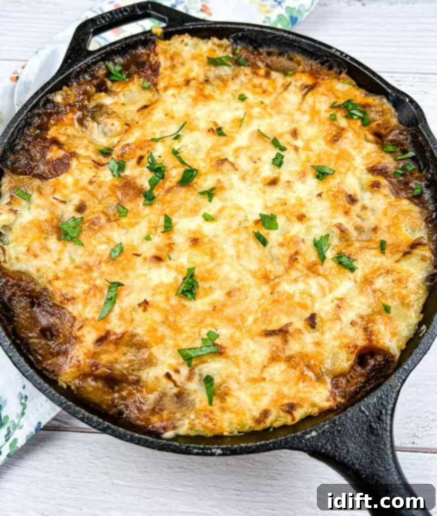 Leftover Roast Beef Shepherd's Pie in a cast iron dish, ready to be served.